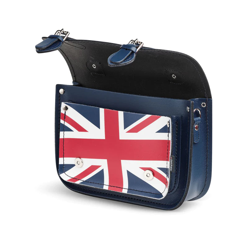 An open satchel bag, in blue, featuring the Union Jack on the front pocket