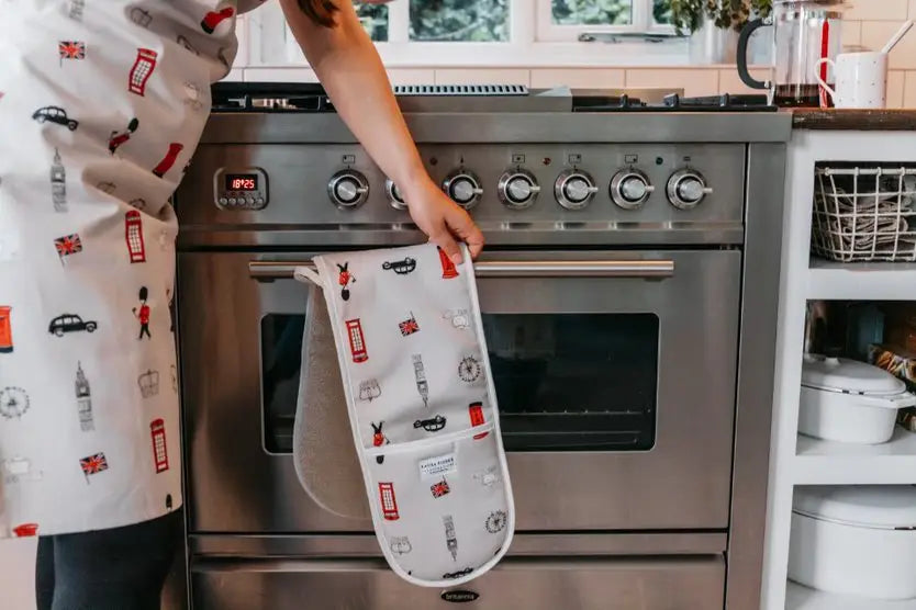 Double oven gloves hanging on a stove